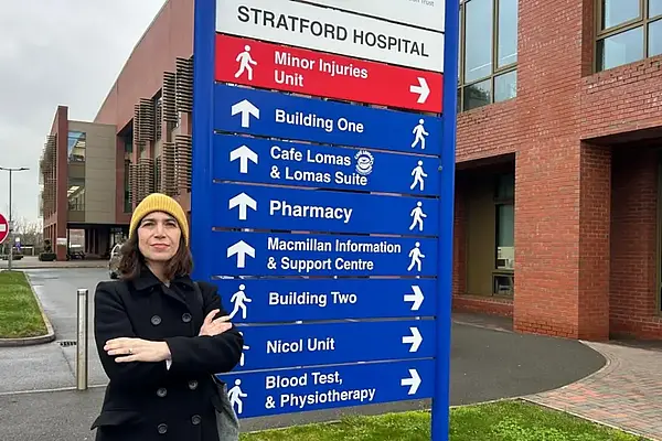 Manuela standing by the Minor Injuries Unit